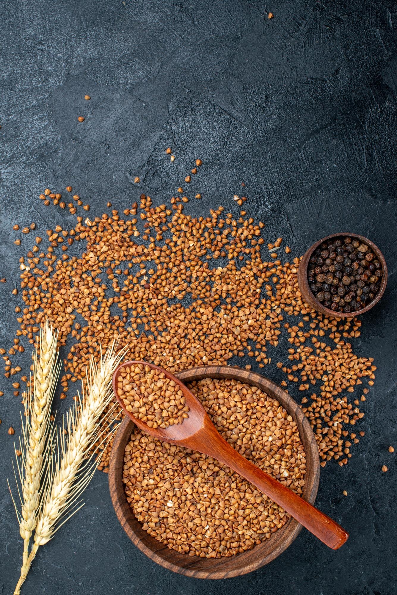 top view raw buckwheat fresh ingredients inside brown plate grey space 140725 97975